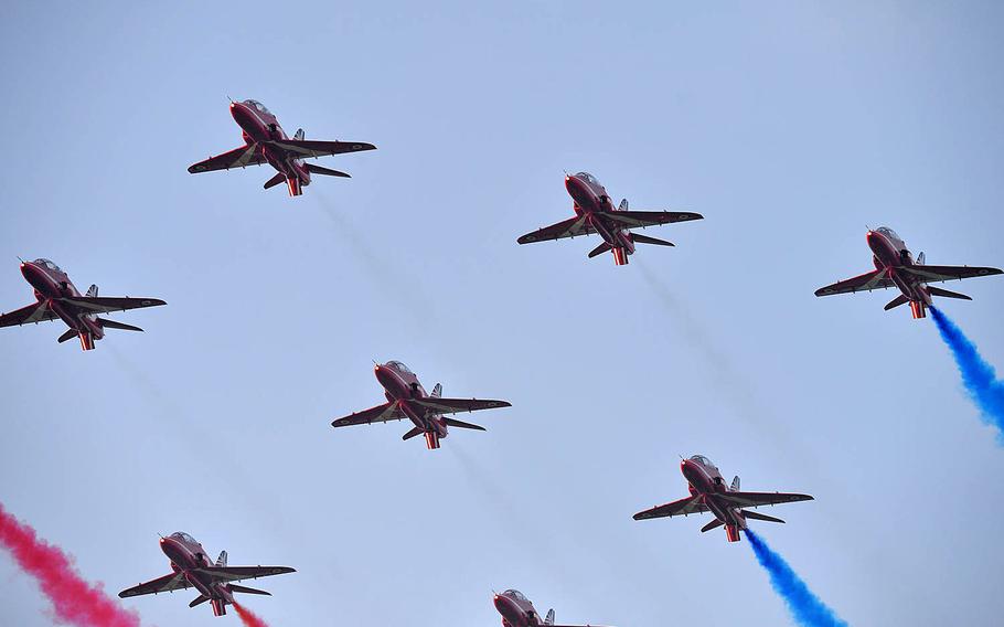 The Royal Air Force's Red Arrow's aerobatic display team flies past the site of the NATO summit in Newport, Wales, Friday, Sept. 5, 2014. They were the last group of jets participating in the flyby that included planes from various NATO members including two U.S. Air Force F-15Cs. The two-day NATO summit wrapped up on Friday. 