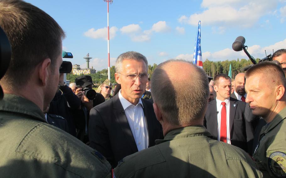 NATO Secretary General Jens Stoltenberg meets with U.S. Air Force personnel at Lask air base in Poland, where he was making his first overseas visit as the alliance's top civilian, on Oct. 6, 2014,