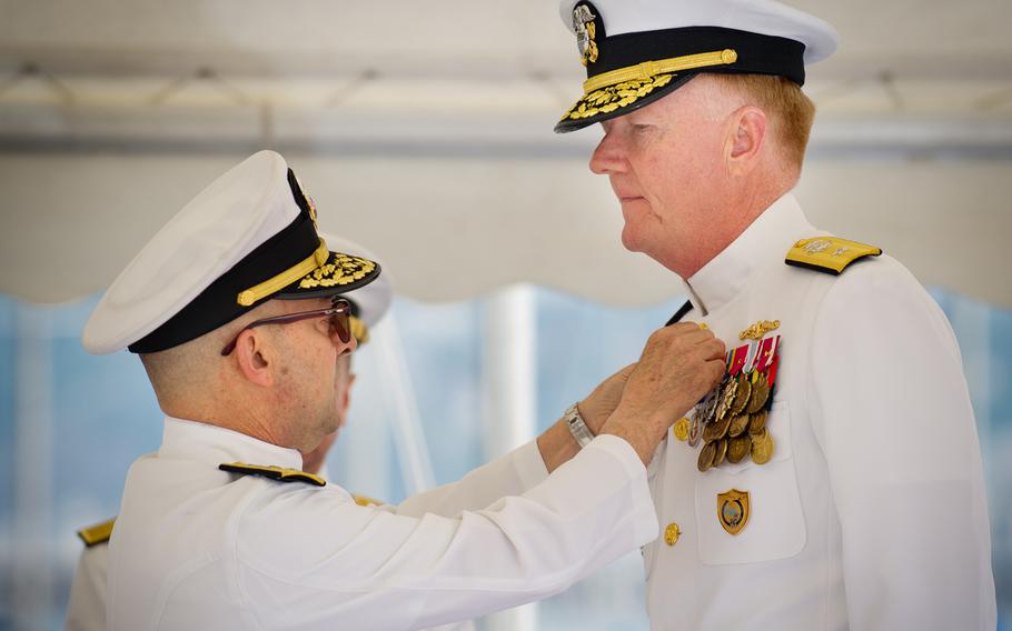 Adm. James Stavridis, supreme allied commander Europe, awards Rear Adm. James Foggo, with the NATO Meritorious Service Medal, during a change of command ceremony at Maritime Command Naples-headquarters in May 2012.