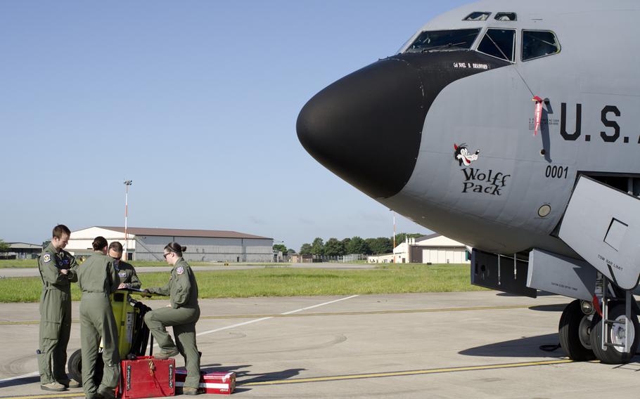 An aircrew stands beside a KC-135 Stratotanker at RAF Mildenhall, England, on June 11, 2014. On Jan 8, 2015, the Defense Department announced that it would return the base to England and move the Air Force's air refueling wing to Germany.
