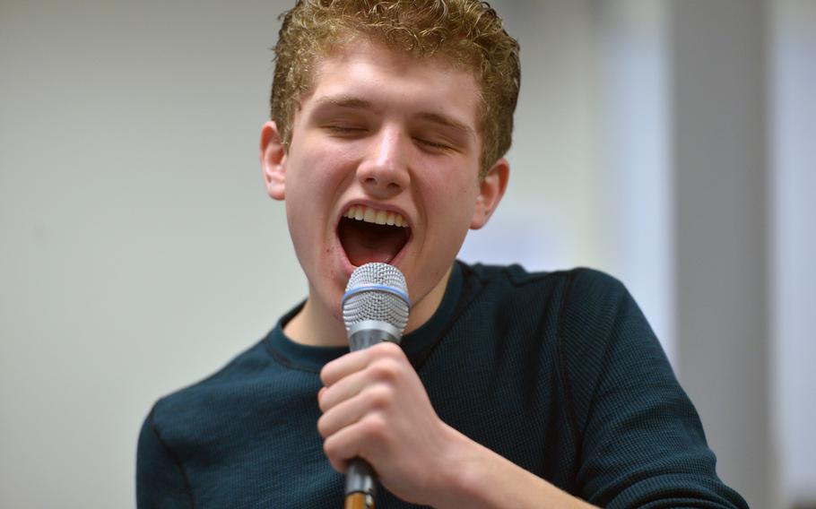 Kaiserslautern's Harris Swasey belts out a tune as he and the other members of the jazz vocal ensemble rehearse a song at the DODDS-Europe Jazz Seminar in Ramstein, Germany, Tuesday, Jan. 13, 2015. Thirty-three musicians from eight high schools participated in this year's event.