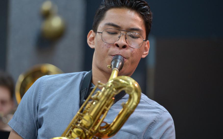 Ramstein's Emanuel DeGuzman blows his baritone saxophone during rehearsals at the DODDS-Europe Jazz Seminar in Ramstein, Germany, Tuesday, Jan. 13, 2015. Thirty-three musicians from eight high schools participated in this year's event.