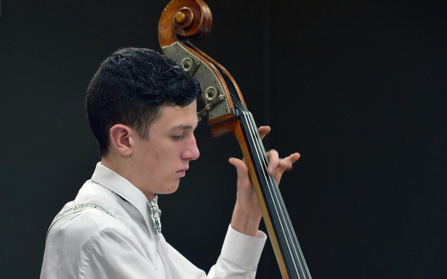 Ramstein's Harrison Reed plays the acoustic upright bass during a number at the DODDS-Europe Jazz Seminar in Ramstein, Germany, Tuesday, Jan. 13, 2015. Thirty-three musicians from eight high schools participated in this year's event.
