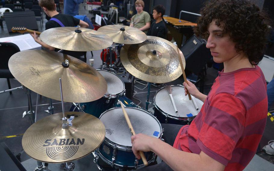Alex Cavoli of Vilseck plays the drums as the big band rehearses a song at the DODDS-Europe Jazz Seminar in Ramstein, Germany, Tuesday, Jan. 13, 2015. Thirty-three musicians from eight high schools participated in this year's event.
