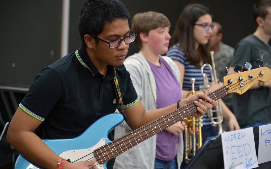 Vicenza's Diegoluis Nacionales keeps the beat on the bass as the big band rehearses a number at the DODDS-Europe Jazz Seminar in Ramstein, Germany, Tuesday, Jan. 13, 2015. Thirty-three musicians from eight high schools participated in this year's event.