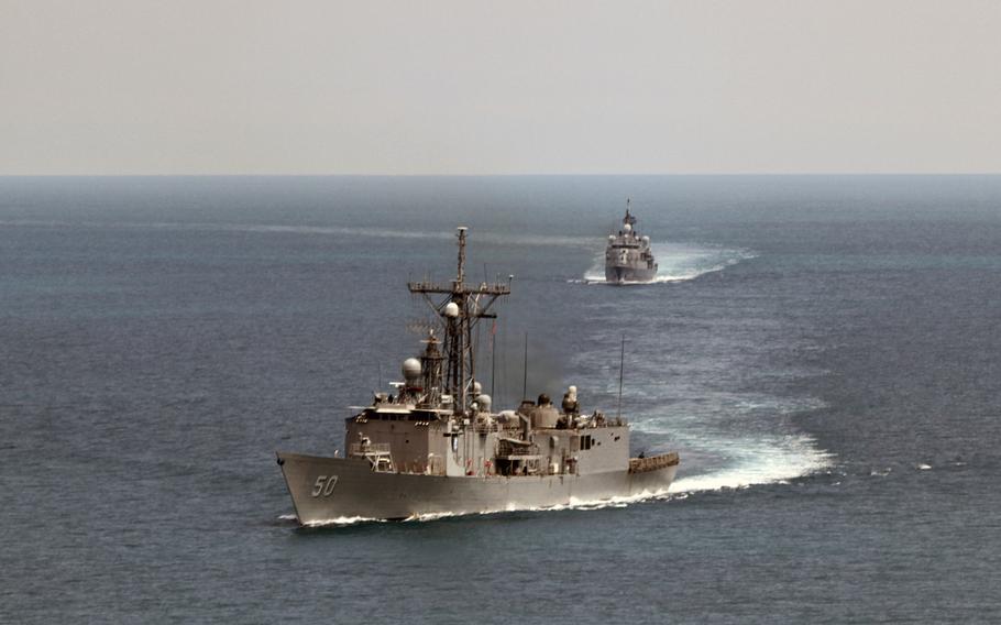 The guided-missile frigate USS Taylor, foreground, and the Turkish navy frigate TCG Turgutries conduct a tactical maneuvering exercise May 11, 2014, in the Black Sea. The USS Taylor went aground in the Turkish port of Samsun on Feb. 12, 2014.

