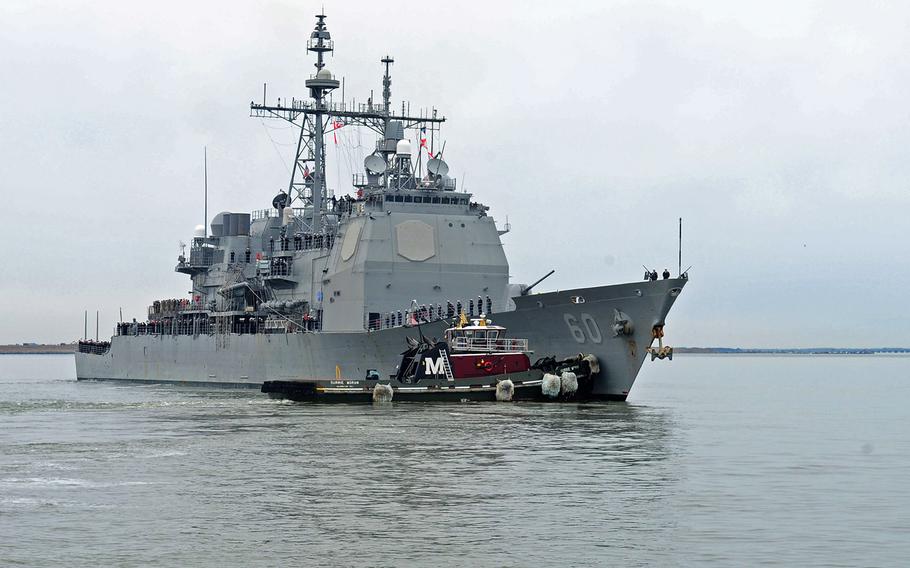 The guided missile cruiser USS Normandy departs on a deployment to the 5th and 6th fleet area of responsibility conducting maritime security operations on March 9, 2015.