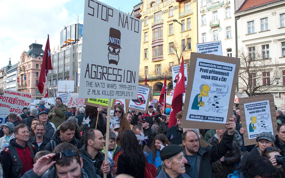Protesters gathered at the foot of Prague's Wenceslas Square to express their opposition to tthe U.S. Army's planned convoy through the Czech Republic, Saturday, March 28, 2015.