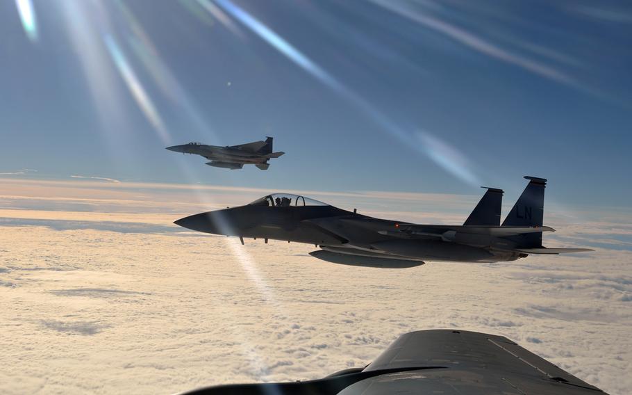 Two F-15C Eagles from the 48th Fighter Wing prepare to return to their simulated air combat portion of the Arctic Challenge exercise Sept. 20, 2013, over Norway. 