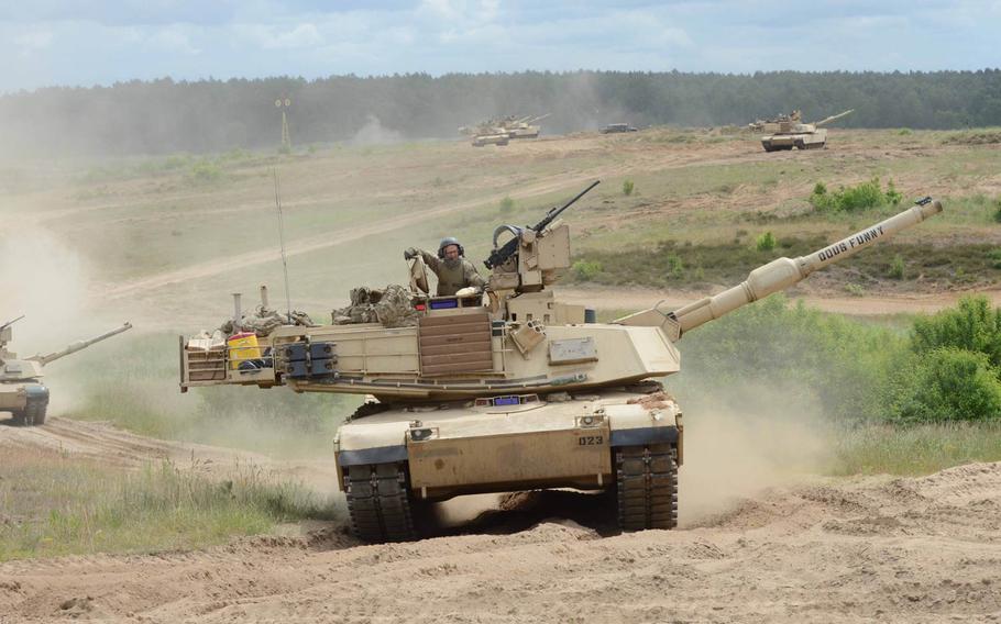 Abrams tanks from the U.S. Army's 3rd Infantry Division take part in a live-fire exercise June 16, 2015, at Drawsko Pomorskie Training Area in Poland. The 3rd ID units in Europe for three months of exercises with NATO allies are expected to leave about 120 pieces of equipment behind when they redeploy to the U.S. this summer. 