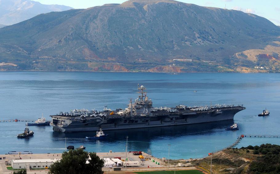The aircraft carrier USS Harry S. Truman departs Souda Harbor after a scheduled port visit in December 2010.