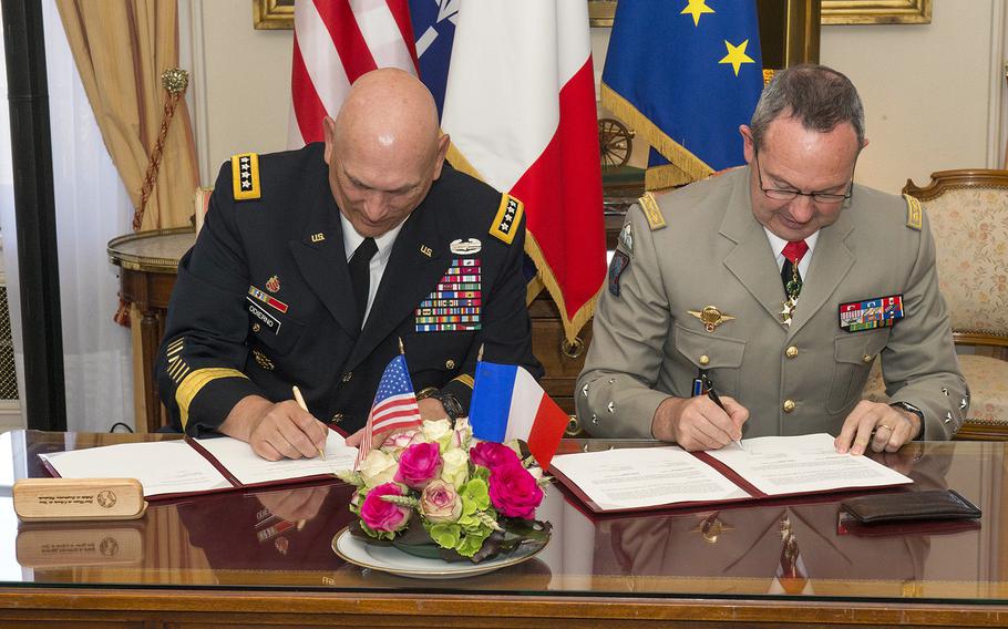 U.S. Army Chief of Staff, Gen. Ray Odierno (left), and France Army Chief of Staff, Gen. Jean-Pierre Bosser sign the French Strategic Vision Statement and Presser in the Hotel des Invalides, Paris, France, on July 10, 2015. Odierno was on a four-day tour of Europe where he visited Soldiers in training, U.S. Army Europe leadership, and dignitaries in four countries.