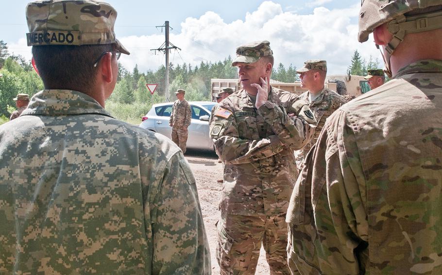 Maj. Gen. Duane A. Gamble, commander of 21st Theater Sustainment Command meets with U.S. Army Engineers with 902nd Engineer Company, 15th Engineer Battalion, 18th Military Police Brigade, during a visit to the Central Training Area in Estonia on July 9, 2015. 