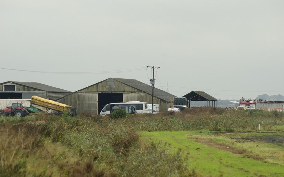 Farm buildings stand near the site of a U.S. F/A-18 crash in Redmere, England, on Wednesday, Oct. 21, 2015. A Marine pilot was killed in the incident.

