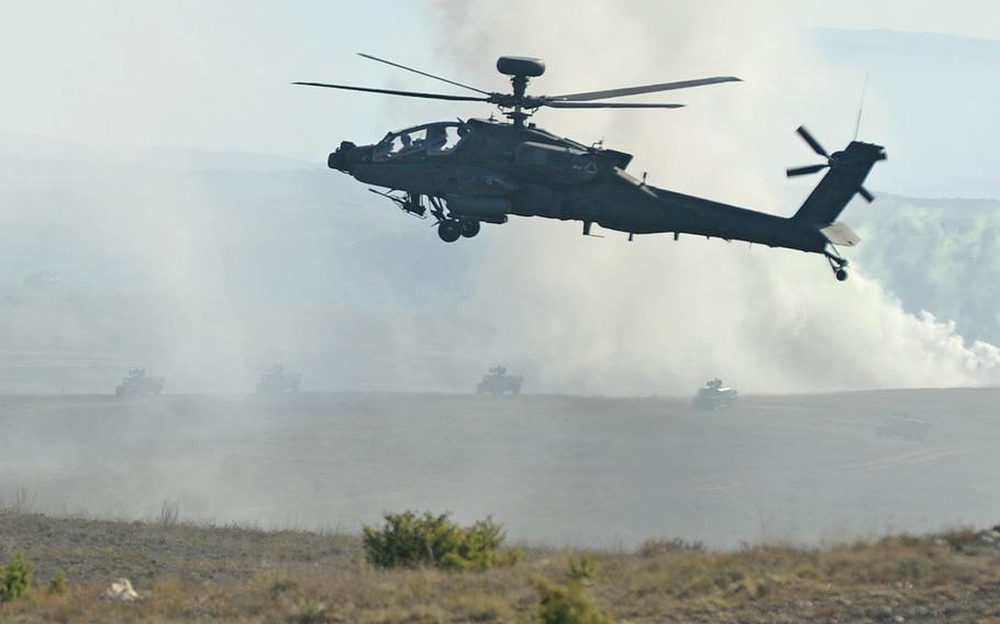 An AH-64 Apache from Company A, 1st Battalion, 3rd Aviation Regiment (Attack Reconnaissance) out of Katterbach, Germany, hovers over the San Gregorio training area near Zaragoza, Spain, during NATO's Trident Juncture exercise, Wednesday, Nov. 4, 2015.
