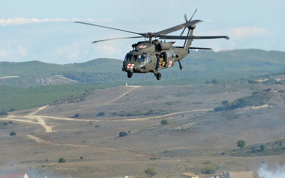 An American UH-60 Black Hawk flies over San Gregorio training area near Zaragoza, Spain, after picking up "wounded" during NATO's Trident Juncture exercise, Wednesday, Nov. 4, 2015.

