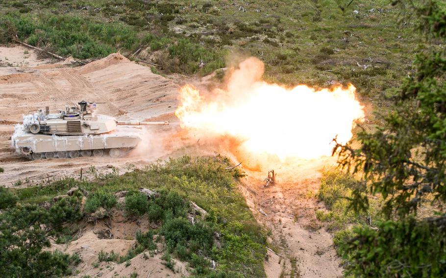 An Abrams tank from the U.S. Army's 3rd Infantry Division fires its 120 mm main gun during a live-fire exercise in June 2015 at the Central Training Area near Tapa, Estonia. A 2016 report by Rand Corp. says NATO does not presently have the capability to defend the Baltics if Russia launched an offensive on those allied states. 


