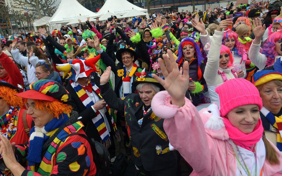 Participants celebrate Altweiberfastnacht, or old women's carnival, on Schillerplatz in downtown Mainz, Germany, Thursday, Feb. 4, 2016.   The event, on the Thursday before Fat Tuesday, or Mardi Gras, traditionally kicks off the final six days of the German carnival season, culminating in the giant Rose Monday parades in Mainz, Cologne and Duesseldorf.


