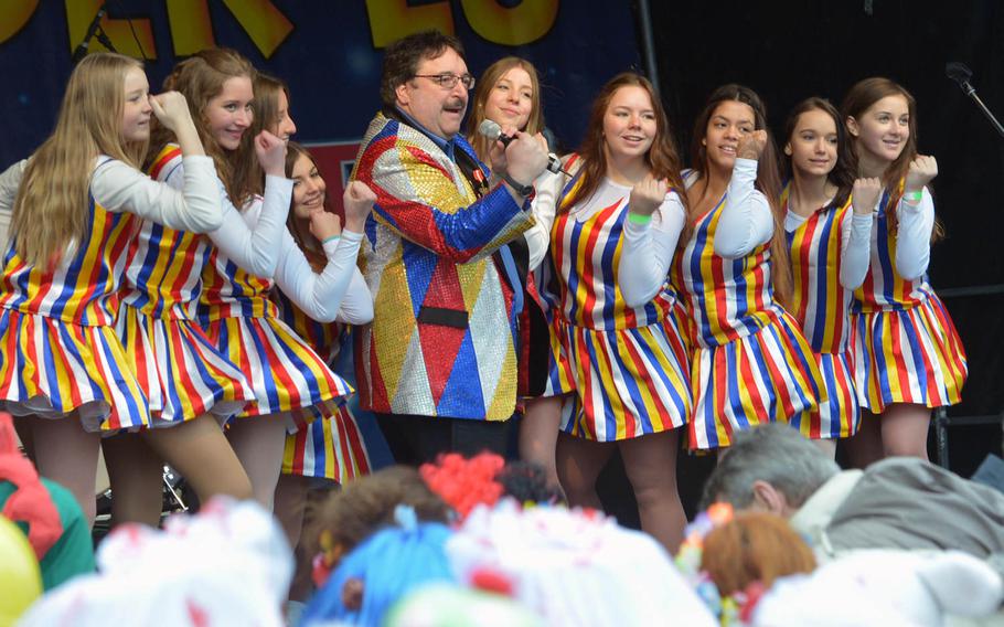 Live and canned music kept the revelers singing and swaying at Altweiberfastnacht, or old women's carnival, on Schillerplatz in downtown Mainz, Germany, Thursday, Feb. 4, 2016. A steady drizzle didn't spoil the fun.

