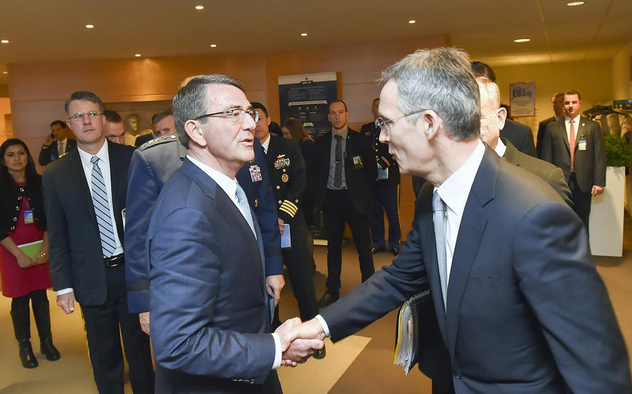 U.S. Secretary of Defense Ash Carter, left, shakes hands with NATO Secretary-General Jens Stoltenberg at NATO headquarters in Brussels, Belgium, Wednesday, Feb. 10, 2016.