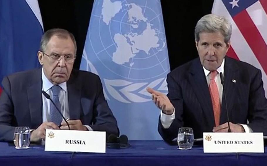 A video screen grab shows U.S. Secretary of State John Kerry speaking as Russian Foreign Minister Sergey Lavrov listens at a briefing before the 2016 Munich Security Conference in Germany.