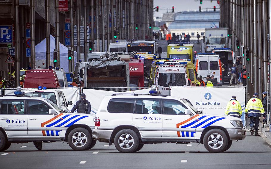 Wetstraat/Rue de la Loi is evacuated at the Maelbeek subway station in Brussels on Tuesday, March 22, 2016, after attacks claimed by the Islamic State killed dozens in the Belgian capital. A U.S. military family was among the scores of people wounded in the attacks, a European Command spokesperson said.