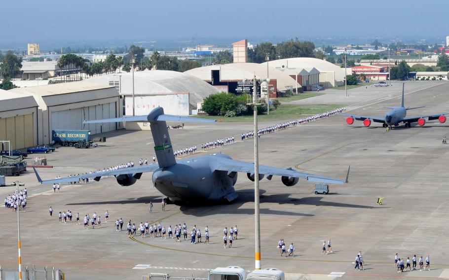 Airmen spread out to begin a foreign-object-debris walk to remove trash and other objects from the flight line at Incirlik Air Base, Turkey, in 2012. The Defense Department has announced on Tuesday, March 29, 2016, that it will start the evacuation all dependents from the base for force-protection reasons.


