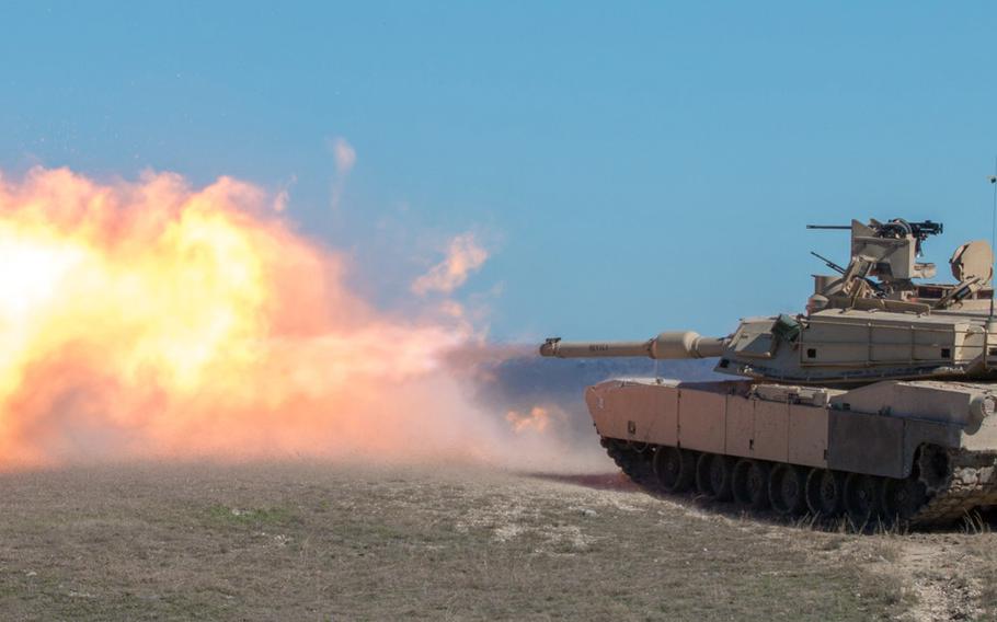 A tank crew from 1st Armored Brigade Combat Team, 1st Cavalry Division, fires the 120 mm main gun of an M1A2 Abrams Main Battle Tank at a target Dec. 3, 2015, at the Sugar Loaf Multi-Use Range at Fort Hood, Texas. U.S. European Command announced Wednesday that U.S. Army Europe would begin receiving continuous troop rotations of U.S.-based armored brigade combat teams to the European theater in February 2017, bringing the total Army presence in Europe up to three fully manned Army brigades.

