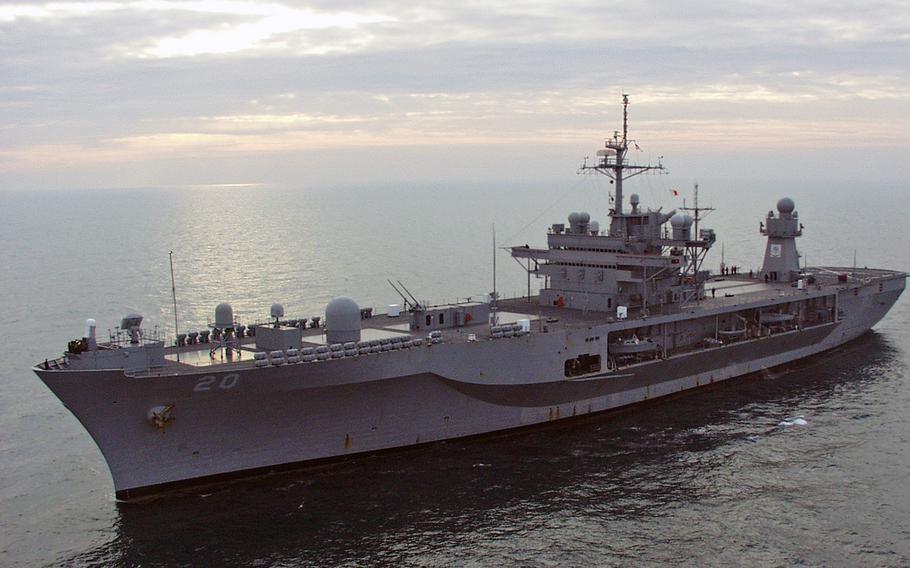 After a 14-day journey across the Atlantic Ocean from Norfolk, Va., the USS Mount Whitney sails toward Gaeta, Italy, just as the sun dawns Tuesday morning, Feb. 1, 2005. 

