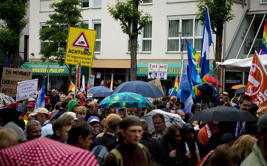 Several hundred protesters march to form a human chain in Ramstein-Miesenbach, Germany, on Saturday, June 11, 2016. The protest, organized by "Stopp Ramstein: No Drone War," was aimed against Ramstein Air Base's alleged role in U.S. drone operations.