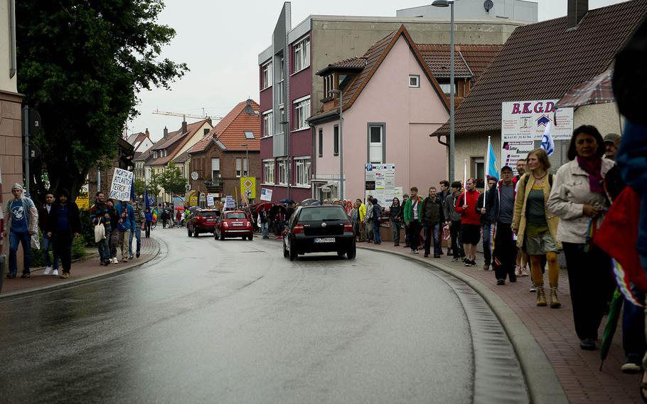 Several hundred demonstrators form a human chain in Ramstein-Miesenbach, Germany, on Saturday, June 11, 2016. They were protesting against Ramstein Air Base's alleged role in U.S. drone operations.




