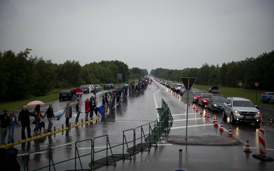 Several thousand protesters form a human chain outside Ramstein Air Base, Germany, on Saturday, June 11, 2016. The protest, organized by "Stopp Ramstein - No Drone War," is against Ramstein Air Base's alleged role in U.S. drone operations.


