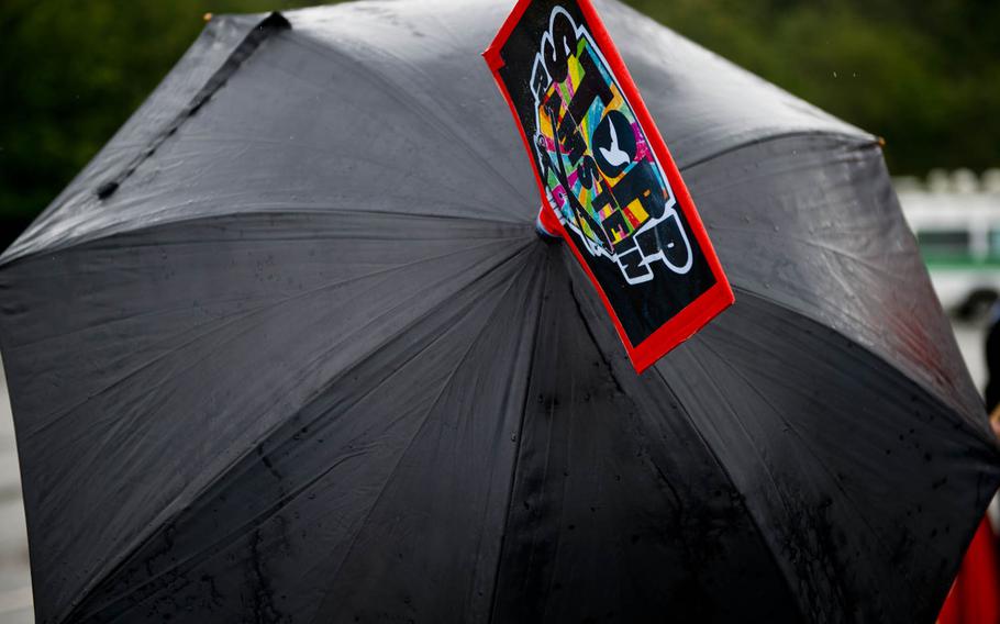 A Stopp Ramstein sign decorates a protester's umbrella outside Ramstein Air Base, Germany, on Saturday, June 11, 2016. The demonstration was held to protest the base's alleged role in U.S. drone operations.



