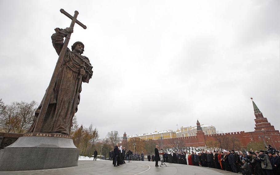 Russian President Vladimir Putin speaks at the unveiling ceremony of a monument to Vladimir the Great on the National Unity Day outside the Kremlin in Moscow, Russia, Friday, Nov. 4, 2016.