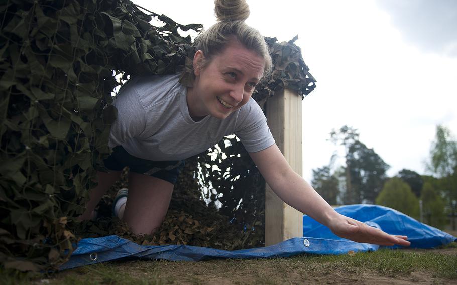 U.S. Air Force 1st Lt. Jenn McCourt, from the 86th Logistics Readiness Squadron, crawls through an obstacle during the annual Courage, Leadership, Education, Advocacy and Respect Challenge at Ramstein Air Base, Germany, on Friday, April 14, 2017.


