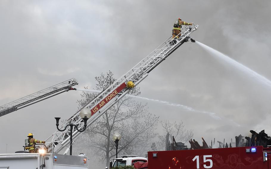 Firefighters worked to put out a fire Sunday afternoon, April 16, 2017, at the Burger King on Ramstein Air Base, Germany. Heavy smoke and flames could be seen from the charred building throughout the afternoon. The nearby Kaiserslautern Military Community Center complex was evacuated. 

Jennifer H. Svan/Stars and Stripes