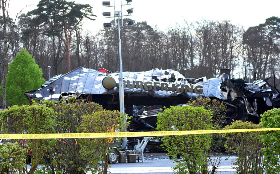 The burned-out husk of the Burger King fast food restaurant at Ramstein Air Base, Germany, was cordoned off by yellow police tape on Monday morning, April 17, 2017. The building was destroyed in the fire, which burned for about 12 hours. Early reports indicate the fire may have started outside the building. 
