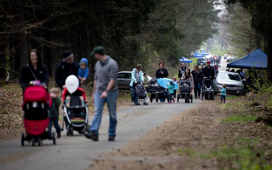 Families walk down a trail during the Kinder Volksmarch at Rhine Ordnance Barracks, Germany, on Saturday, April 22, 2017. USO Kaiserslautern hosted the march in celebration of Earth Day and the Month of the Military Child.