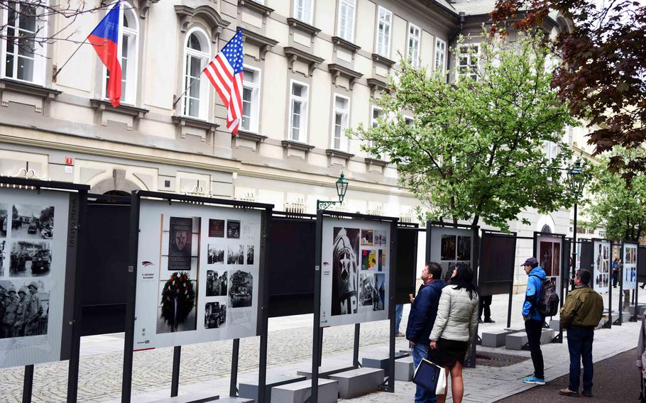 Czech citizens learn about the history of the WWII liberation of Pilsen, Czech Republic, on Friday, May 5, 2017. During the Liberation Festival Pilsen, informative plaques are set up around the city. 