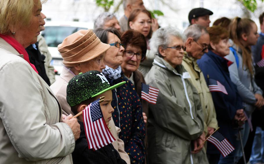 Czech citizens carrying American flags gather to watch a memorial to American soldiers, during the Liberation Festival Pilsen, Friday, May 5, 2017. 