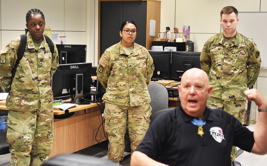 Soldiers give Medal of Honor recipient Gary Littrell rapt attention during his May 15, 2017, visit to the NATO Allied Joint Force Command in Lago Padria, Italy.