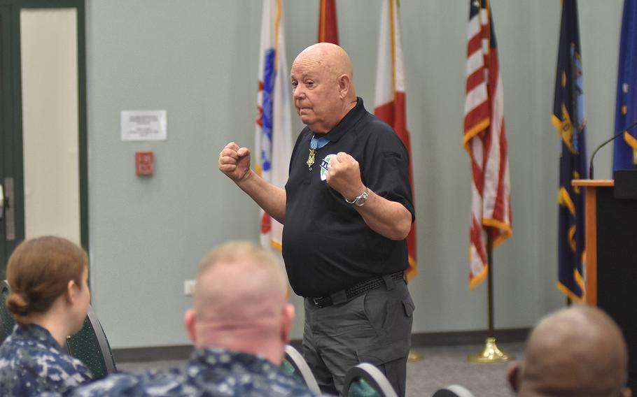 Medal of Honor recipient Gary Littrell talks to sailors at the Navy base in Naples, Italy, on May 12, 2017.  