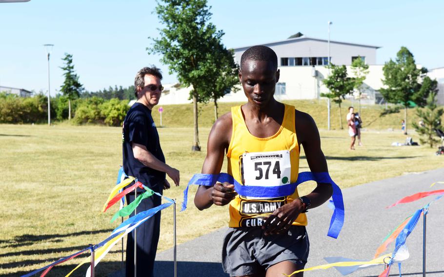 Spc. Elias Chesire, an aircraft mechanic stationed in Wiesbaden, Germany, comes in first place overall at the Army 10-miler qualification run at Grafenwoehr, Germany, Saturday, June 24, 2017. 
