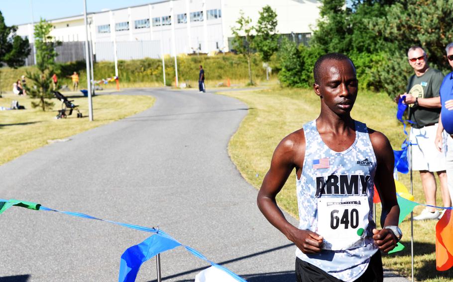 Spc. Michael Biwott finishes in second place, with a run time of 52 minutes and 54 seconds at the Army 10-miler qualification run at Grafenwoehr, Germany, Saturday, June 24, 2017. 


