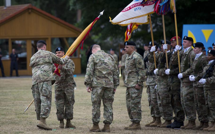 U.S. Army Europe commander Lt. Gen. Ben Hodges, left, passes the 21st Theater Sustainment Command's colors to Maj. Gen. Steven Shapiro during the TSC's change-of-command ceremony at Daenner Kaserne, Germany, on Friday, June 30, 2017.
