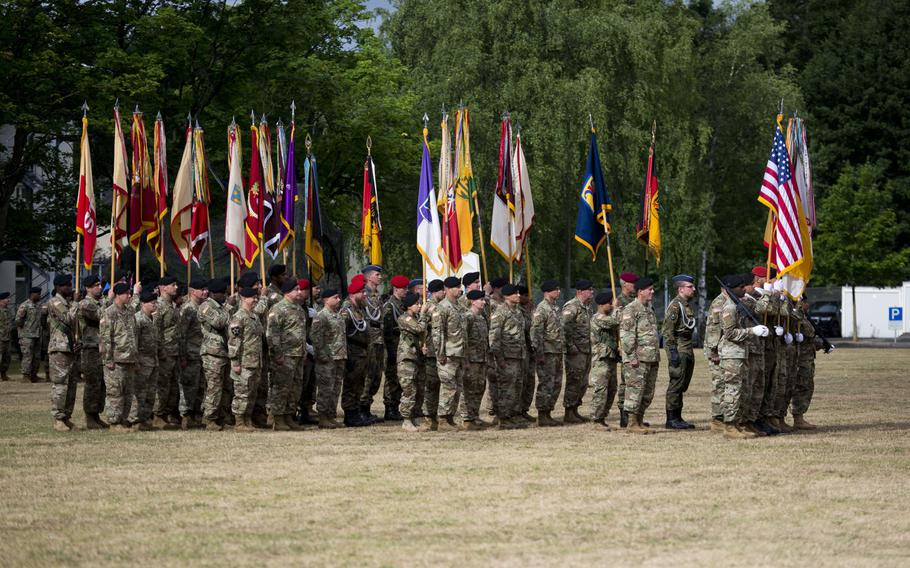 National and Army flags and colors of various units of the 21st Theater Sustainment Command are displayed in formation during the TSC's change-of-command ceremony at Daenner Kaserne, Germany, on Friday, June 30, 2017.