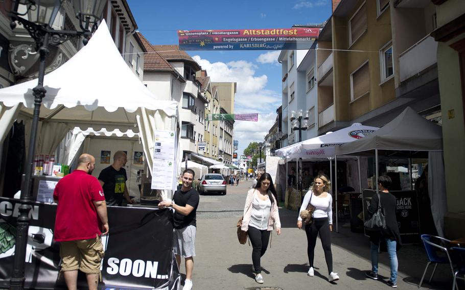 Vendors prepare a booth for the annual Lautrer Altstadtfest in Kaiserslautern, Germany, on Friday, June 30, 2017. The number of visitors this year is expected to be about 200,000.