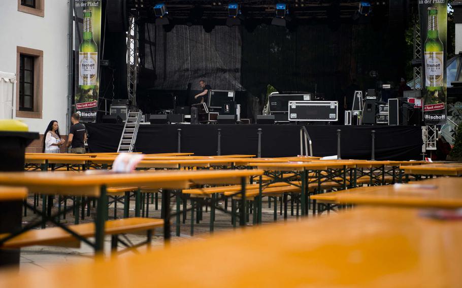 A sound technician sets up a stage for the annual Lautrer Altstadtfest in Kaiserslautern, Germany, on Friday, June 30, 2017. The festival features shopping, food and live music.