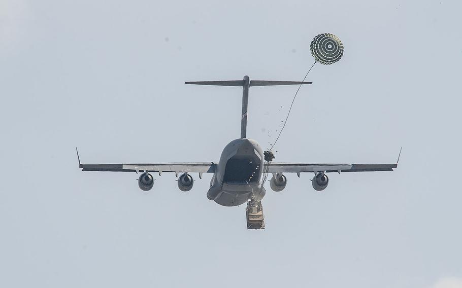 Soldiers of the 173rd Airborne Brigade release a heavy drop from a Boeing C-17 Globemaster III while conducting an airborne operation during exercise Saber Junction 16 on April 11, 2016 at Joint Multinational Readiness Center in Hohenfels, Germany.