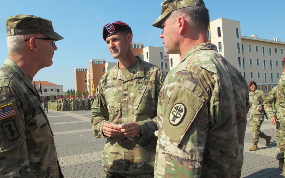 Col. James B. Bartholomees III, center, new commander of the 173rd Airborne Brigade, chatted with colleagues before a change-of-command ceremony on Friday, July 7, 2017, in Vicenza, Italy.